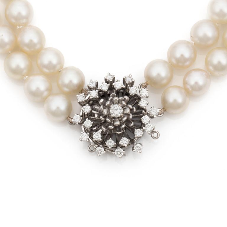 A two strand cultured saltwater pearl necklace. Pearls Ø 9 - 9,5 mm. Clasp set with diamonds.