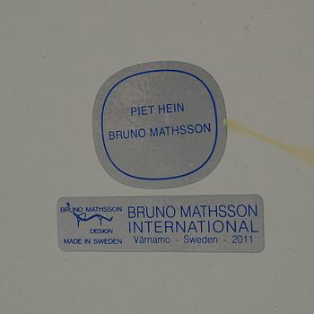 A 'Superellips" table by Bruno Mathsson & Piet Hein for Mathsson International darted 2011.