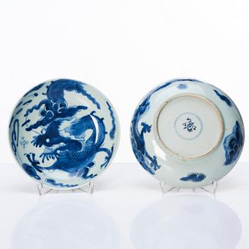 A set of four blue and white dragon dishes, Qing dynasty, 18th Century.