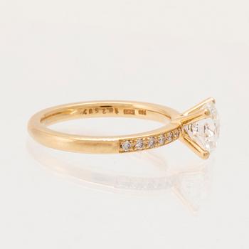 An 18K gold ring set with round brilliant-cut diamonds, GIA report.