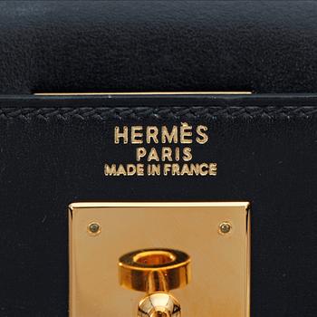 HERMÈS, a black leather, "Kelly 32".