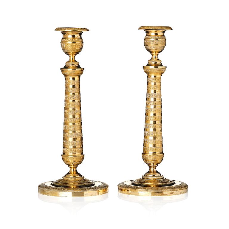 A pair of French Empire candlesticks.