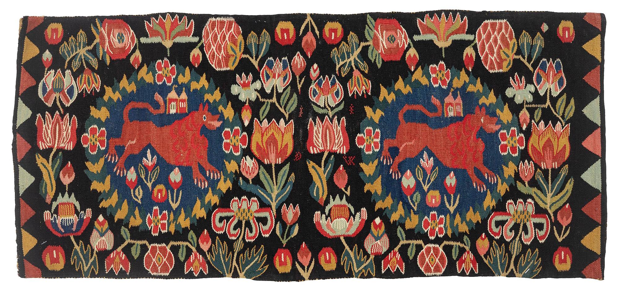 A cushion, 'Red Lion' (Rött Lejon), tapestry weave, c. 102 x 46cm, southwestern Scania, first part of the 19th century.