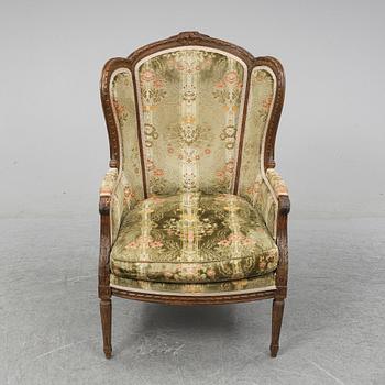 A Louis XVI style armchair from around year 1900-.