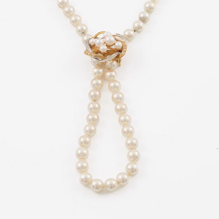 Necklace with imitation pearls, clasp 18K gold with amethyst, spacers 18K gold with pearls and diamonds.