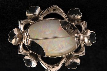 A BROOCH, brilliant- and 8/8 cyt diamonds c. 0.25 ct. Opal 22x15 mm. Marked KB Uppsala 1964. Weight 9,3 g.