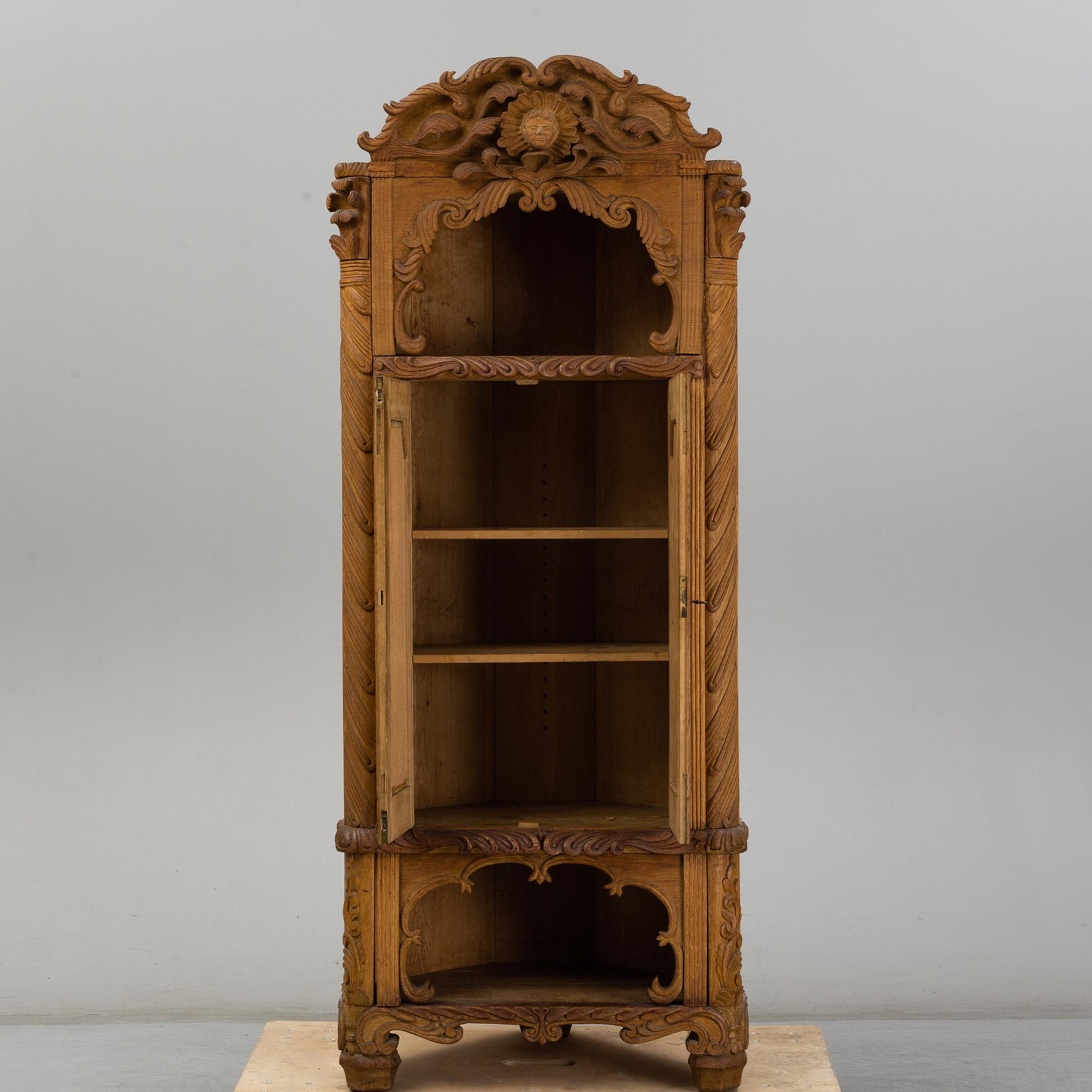 KNUT FJAESTAD, a folk art oak cabinet, signed KF 1935.