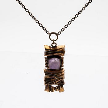A bronze necklace set with an amethyst by Pentti Sarpaneva.