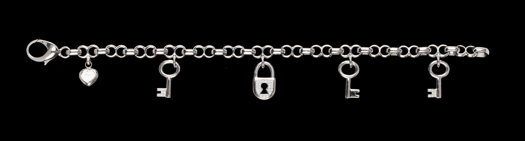 ARMBAND, Chopard, fem berlocker i form av hjärta, nycklar och hänglås.