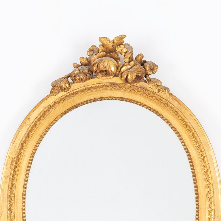 A Gustavian-style gilt-gesso mirror, early 20th century.