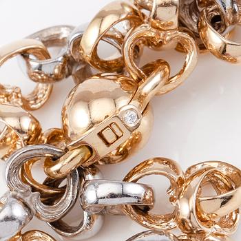 ARMBAND, 18K guld/vitguld samt mindre diamant, Per Borup. Total vikt ca 29 g.