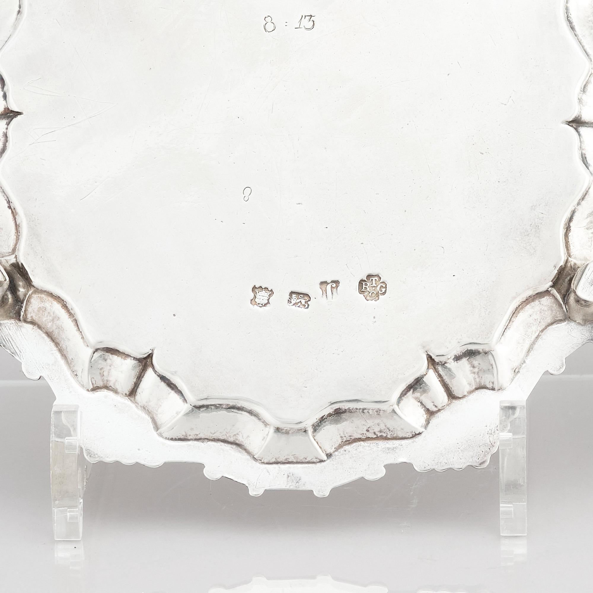 A pair of English silver salvers/plates, marks of Thomas Cooke II and Richard Gurney, London 1753.