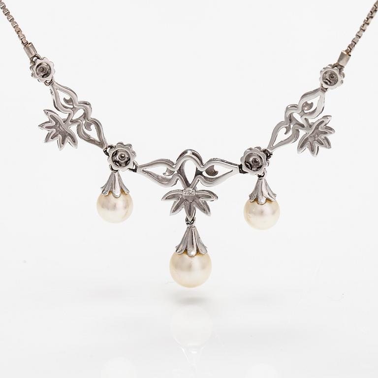 An 18K white gold necklace with cultured pearls and diamonds ca. 0.04 ct in total. Finnis import marks 1963.