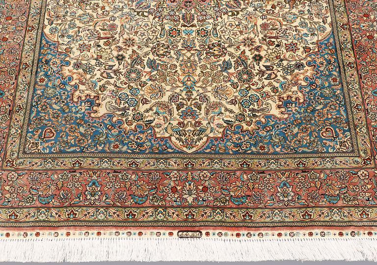 A rug, Figural Oriental silk,  signed, ca 175 x 125 cm.
