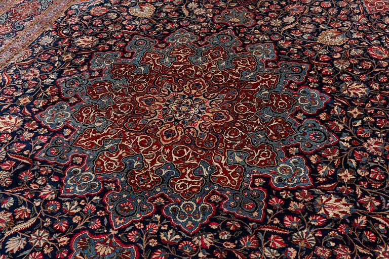 A semi-antique Kashan 'Dabir' carpet, central Persia (Iran), c. 437 x 299 cm.