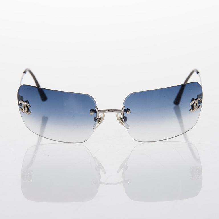 Prada and Chanel Sunglasses.