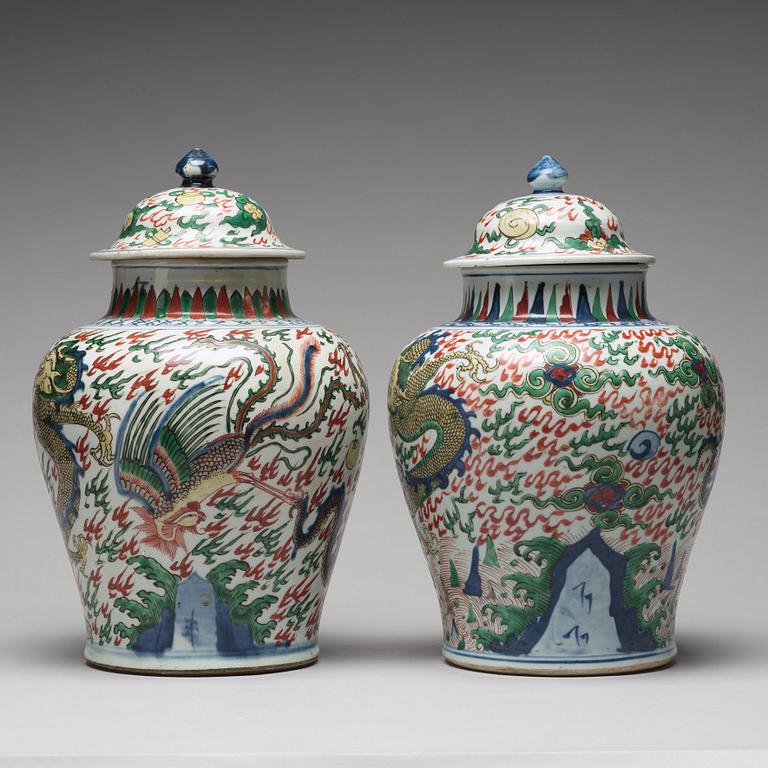 Two Transitional Wucai Baluster vases and covers, 17th Century.