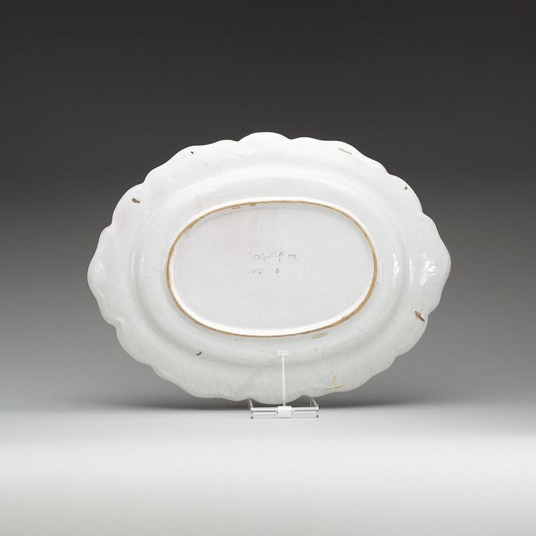 A Swedish Rörstrand faience charger, dated 11/1 (17)73.