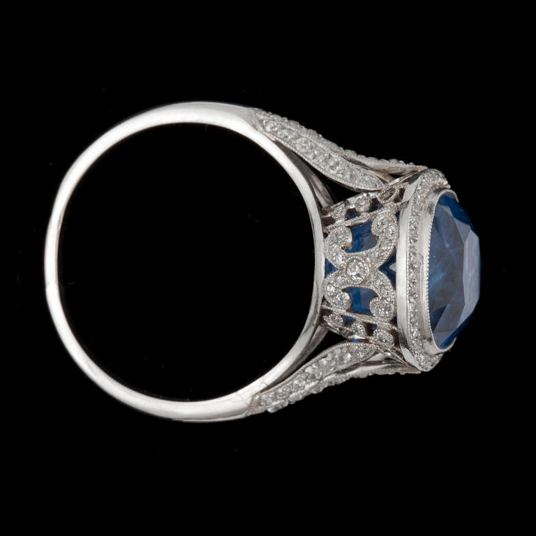 A sapphire, circa 11.25 cts, and old-cut diamond, total carat weight circa 1.00 ct, ring.