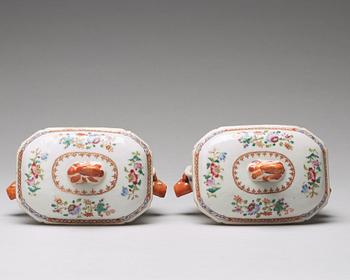 A pair of famille rose 'double peacock' butter tureens with covers and stands, Qing dynasty, Qianlong (1736-95).
