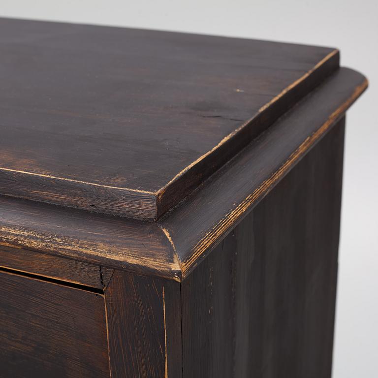 A chest of drawers, circa 1900.