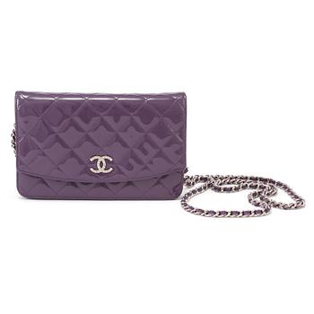 A purple lacquer handbag by Chanel  2011.