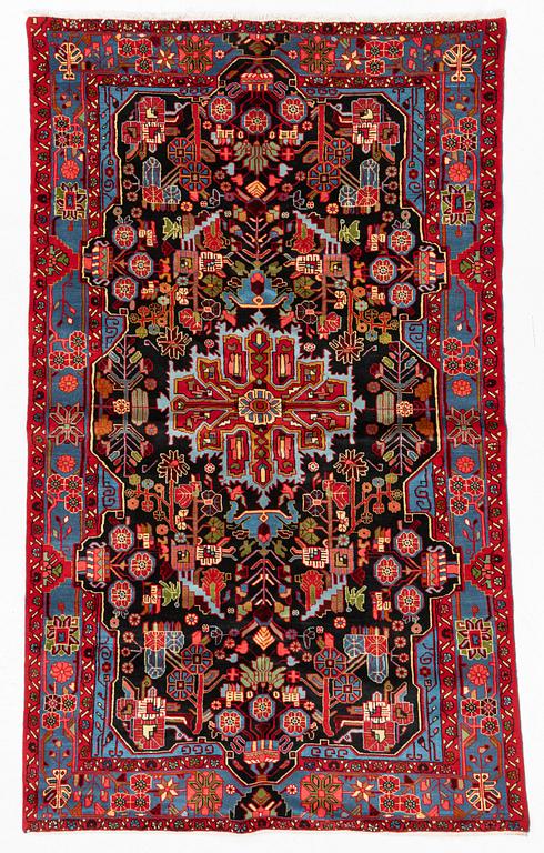 An oriental rug, ca 247 x 146-156 cm.