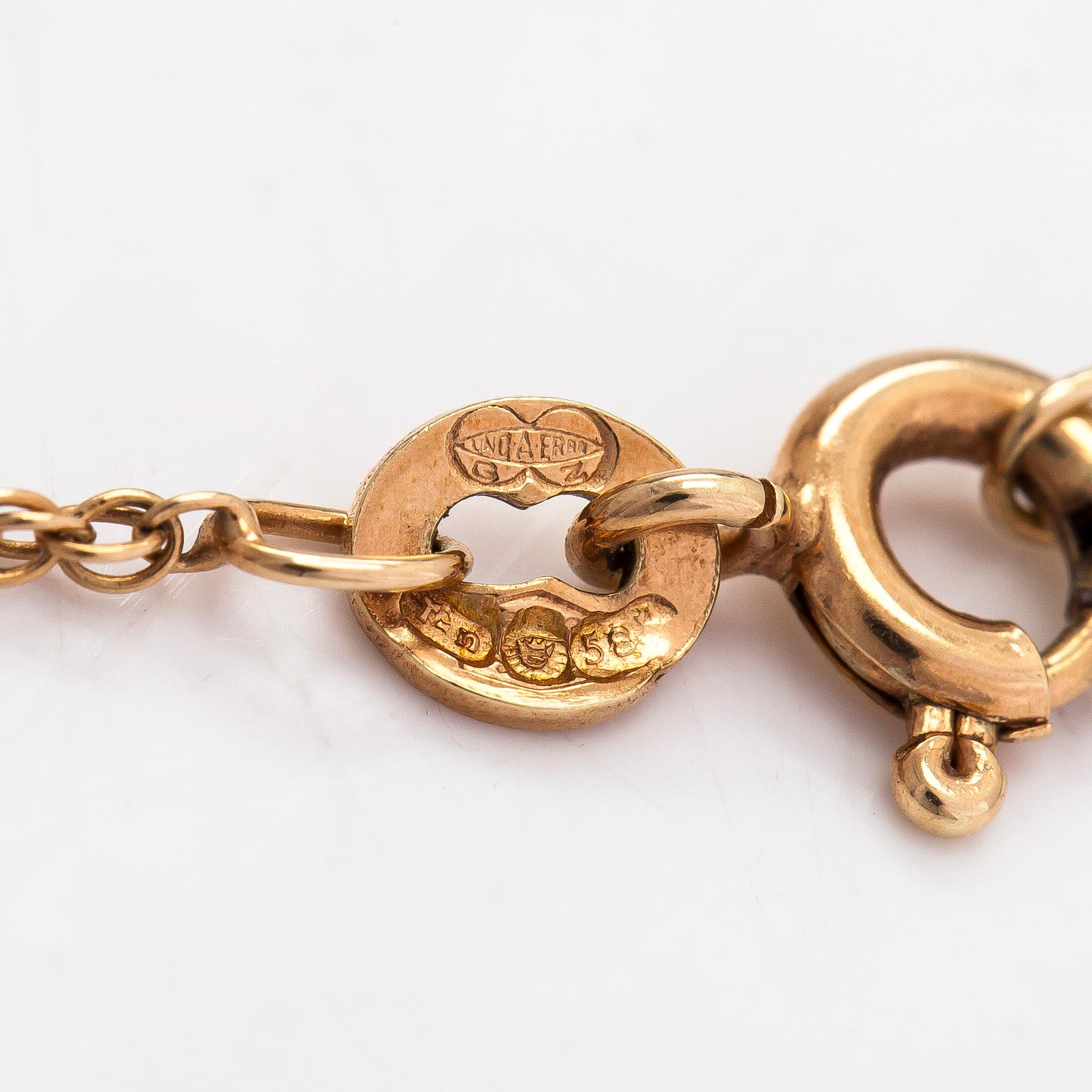 A 14K gold pendant, Sammon Sepät, Tampere 1970 with chain.