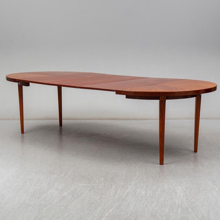 a mahogany dining table from the mid 20th century.