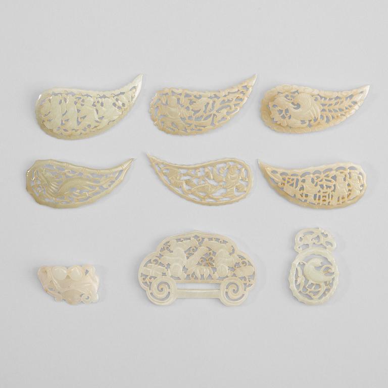 A set of nine carved white nephrite pendants and leafs, late Qing dynasty (1644-1912).