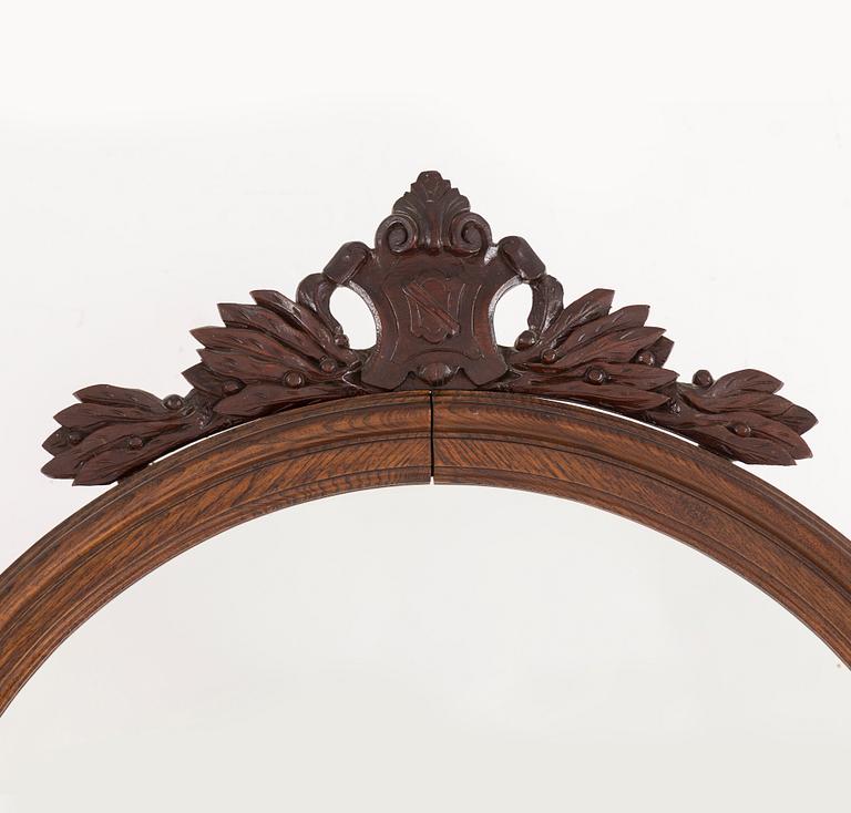 A late 19th century oak mirror.