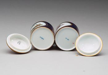 Two Berlin cups with covers and stands, circa 1800.