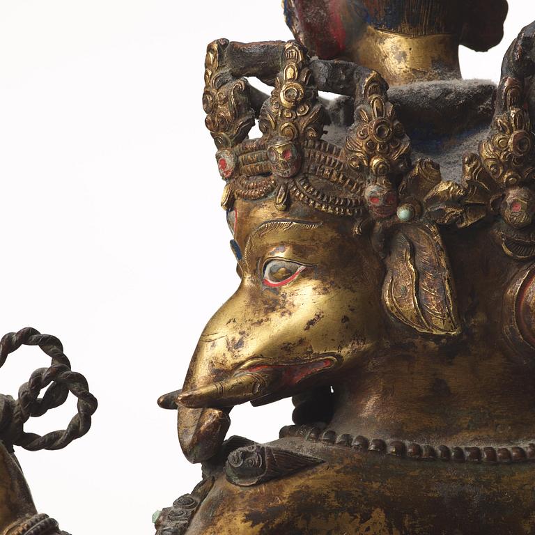 A large Tibetan eight armed deity, probably 20th Century.