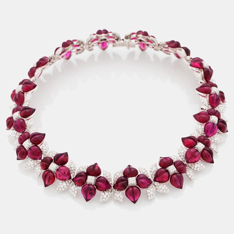 A carved pink tourmaline and diamond collar with floral motifs. Total carat weight of diamonds circa 16.00 cts.