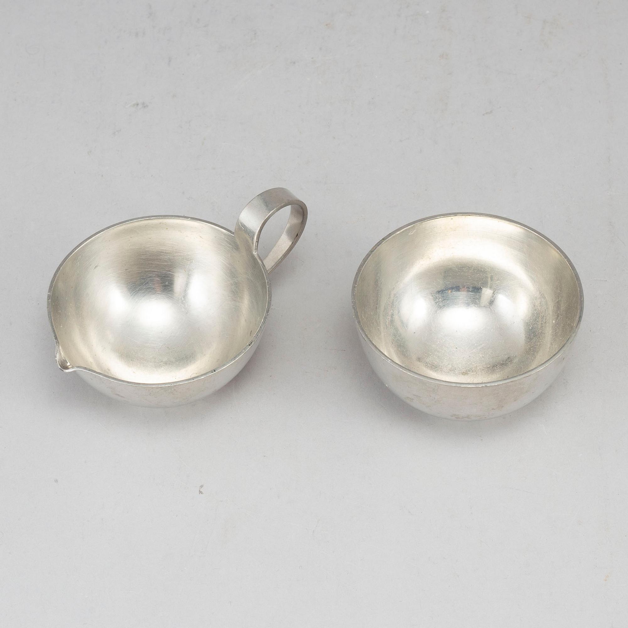 FIRMA SVENSKT TENN, a pewter sugar bowl and creamer. Stockholm 1957.