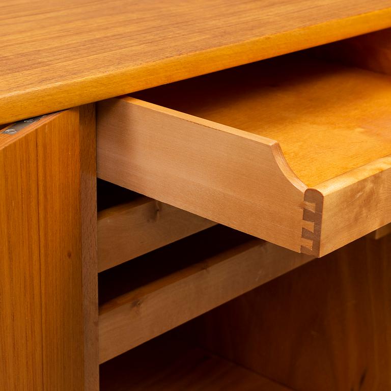 A late 20th Century teak veneered sideboard.