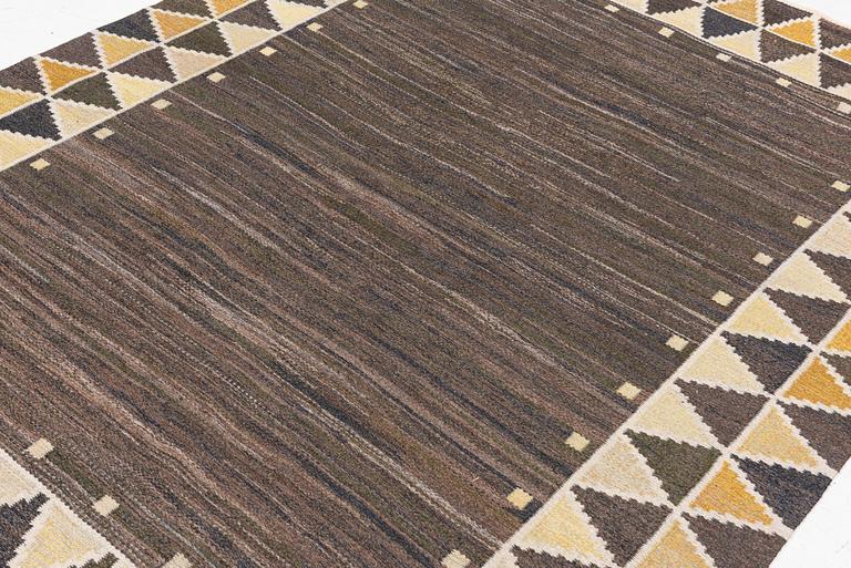 A flat weave rug, c. 245 x 185 cm.