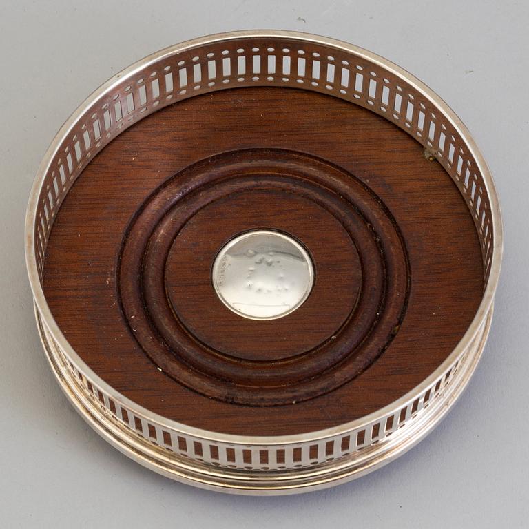 Six mahogany and sterling silver coasters, Carrs of Sheffield, Shefield, England 2003.