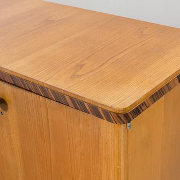 A "MODEL OK" SIDEBOARD DESIGNED BY AXEL EINAR HJORTH FOR NORDISKA KOMPANIET.