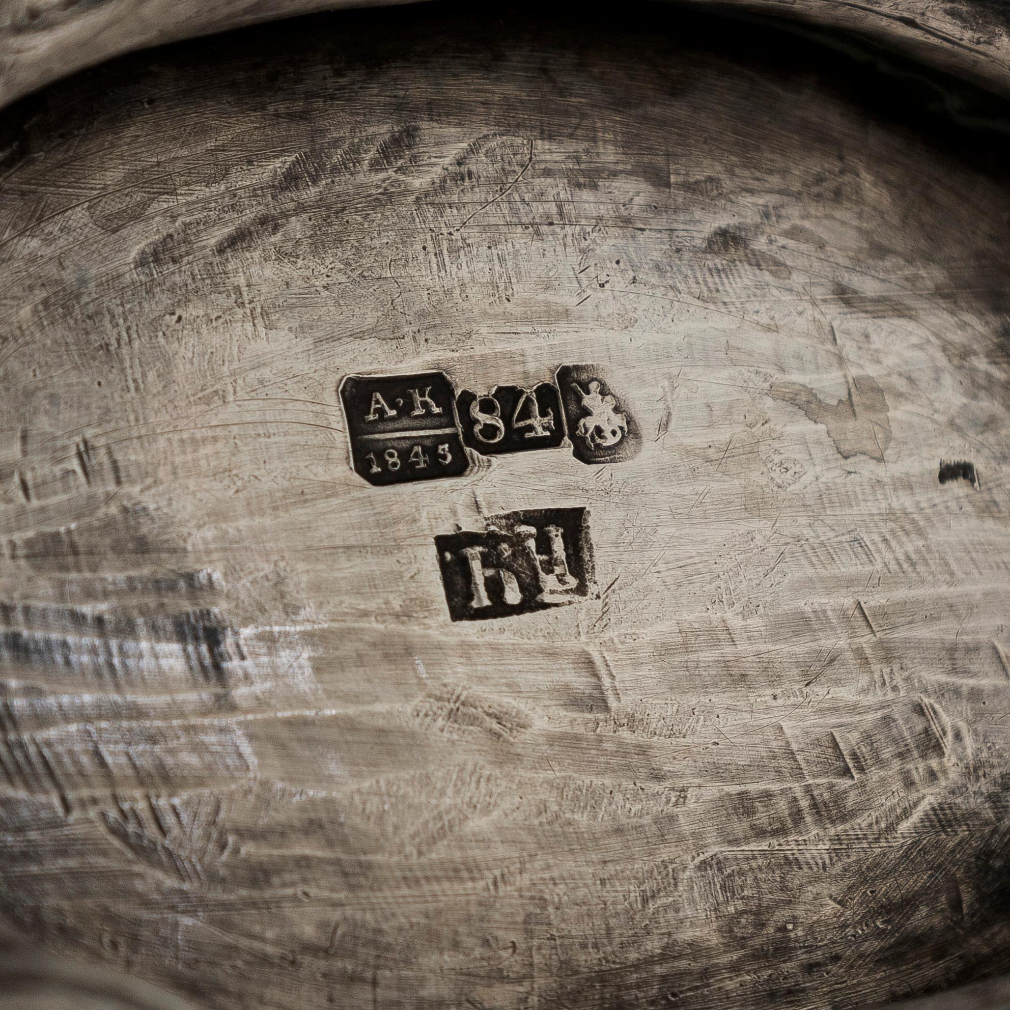 A parcel-gilt silver teapot, Moscow 1845.