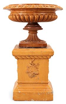 622. A Scottisch late 19th century yellow glazed stoneware garden urn and base by J&M Craig.