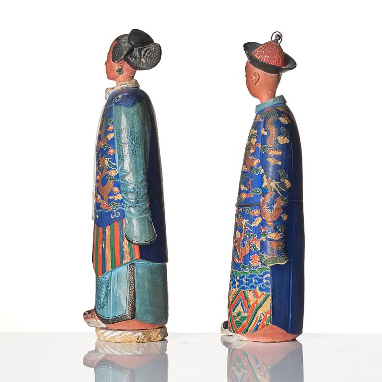 A pair of Chinese Export polychrome painted nodding head figures, Qing dynasty, early 19th Century.