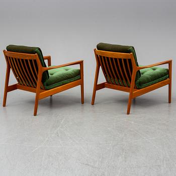 A pair of 'USA 75' easy chairs by Folke Ohlsson, Dux.