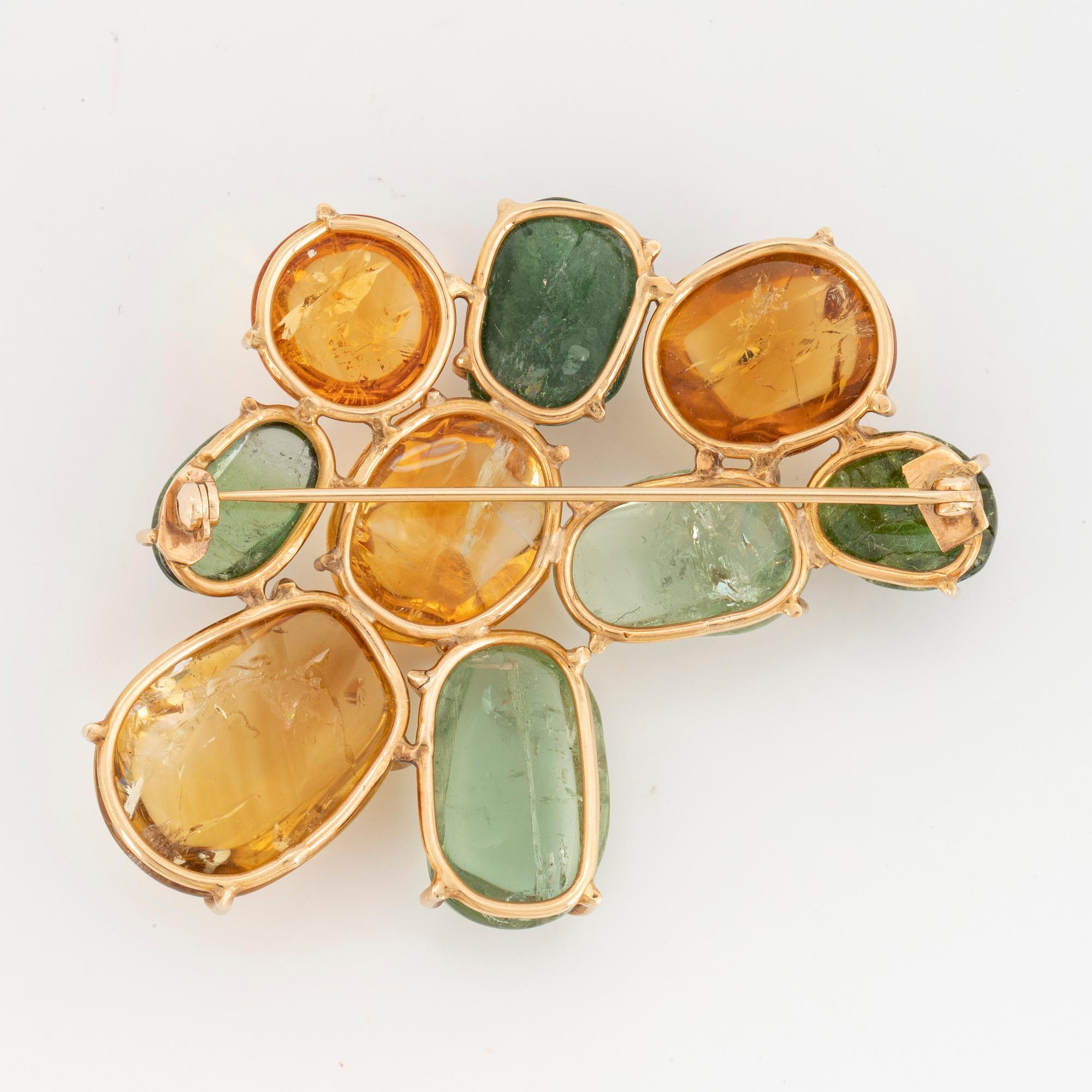 Cabochon-cut citrine and green tourmaline brooch.