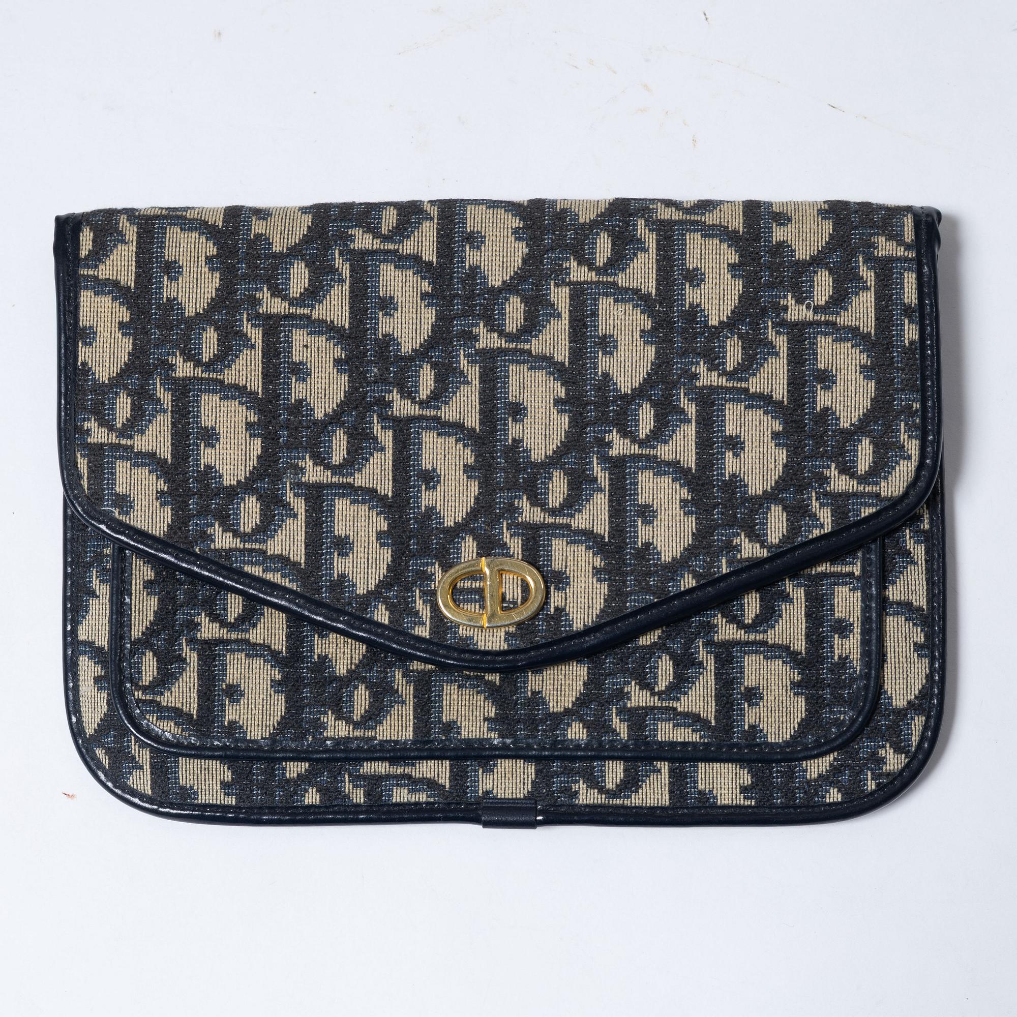 Christian Dior, a clutch and a scarf.