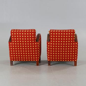 A pair of 1930s armchairs.