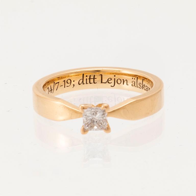 An 18K gold solitaire ring "Maui" set with a princess-cut diamond by Schalins.