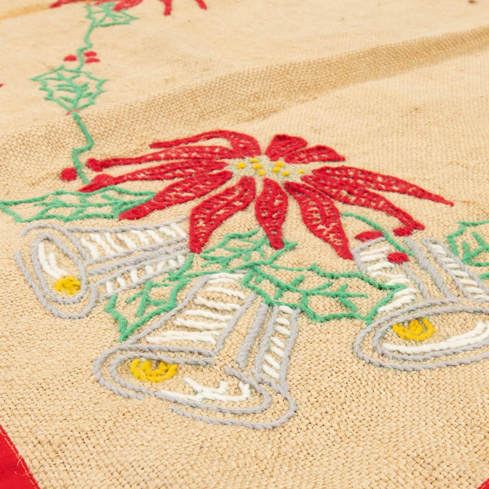 A collection of Christmas tablecloths, Christmas tree skirts, an apron, and runners, 21 pcs, 20th century.