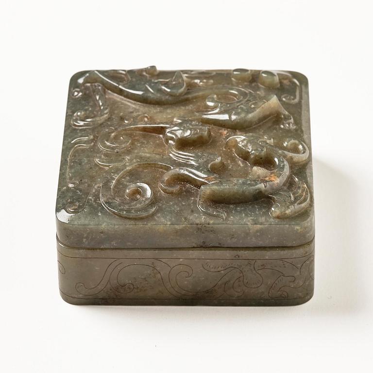 A well carved green stone box with cover, China, 20th century.