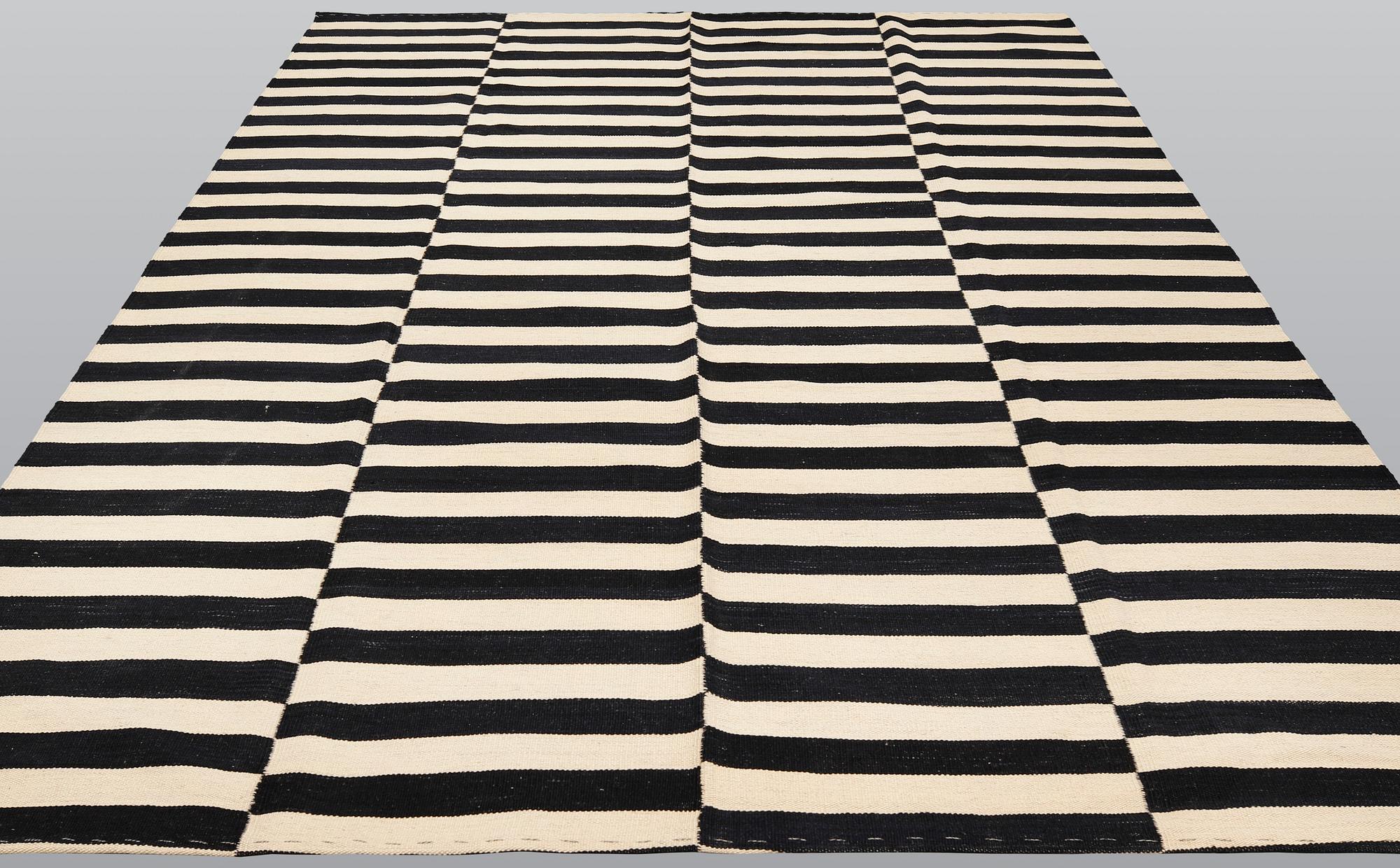 A carpet, flat weave, ca 288 x 210 cm.
